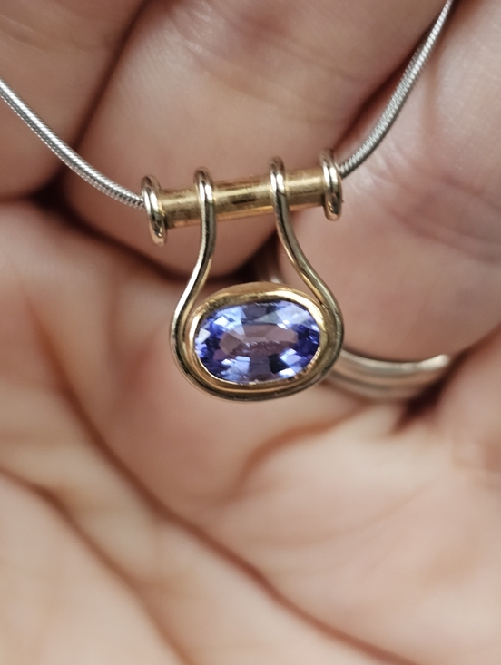Stampd Jewelry - 14k tanzanite necklace! White gold snake chain and the pendant is yellow gold. T